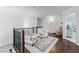 Bright loft featuring cozy seating and view into another room, with hardwood floors at 1811 Fountain Hill Ct, Duluth, GA 30097