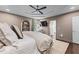 Bright main bedroom features a tray ceiling, large bed, sitting area, and ample natural light at 1811 Fountain Hill Ct, Duluth, GA 30097