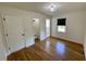 Bedroom showcasing hardwood floors and multiple entry points at 2682 Pineland Ave, Atlanta, GA 30340