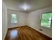Bedroom featuring hardwood floors, a window, and neutral wall color at 2682 Pineland Ave, Atlanta, GA 30340