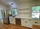 Modern kitchen with white cabinets, quartz countertops, stainless steel appliances, and subway tile backsplash at 2682 Pineland Ave, Atlanta, GA 30340