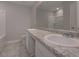 Well-lit bathroom featuring granite countertops and double sinks at 496 Charleston Pl, Villa Rica, GA 30180