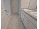 Bathroom with double sinks and granite counters at 496 Charleston Pl, Villa Rica, GA 30180