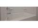 Clean white bathtub with chrome fixtures at 496 Charleston Pl, Villa Rica, GA 30180