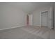 Bright bedroom with plush carpet and a walk in closet at 496 Charleston Pl, Villa Rica, GA 30180