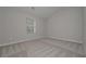 Minimalist bedroom with neutral paint and plush carpeting at 496 Charleston Pl, Villa Rica, GA 30180