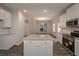 Modern kitchen with an island, stainless steel appliances and open to living area at 496 Charleston Pl, Villa Rica, GA 30180