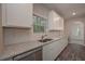 Kitchen featuring white cabinets and stainless steel appliances at 496 Charleston Pl, Villa Rica, GA 30180