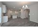 Bright kitchen features white cabinets, granite countertops, stainless steel appliances, and center island at 496 Charleston Pl, Villa Rica, GA 30180