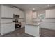 Well-lit kitchen features white cabinetry, stainless steel appliances, and granite countertops at 496 Charleston Pl, Villa Rica, GA 30180
