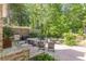 Spacious outdoor patio featuring ample seating, a dining table, and a built-in barbecue at 1272 N Highland Ne Ave, Atlanta, GA 30306
