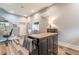 Finished basement featuring modern wood flooring, an island, stairs, and a door to the outside at 1272 N Highland Ne Ave, Atlanta, GA 30306