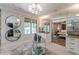 A view of the ensuite bath featuring double mirrors, a vanity with granite counters, and plush rugs at 1272 N Highland Ne Ave, Atlanta, GA 30306