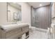 Modern bathroom featuring a sleek vanity, a glass-enclosed shower, and contemporary fixtures at 1272 N Highland Ne Ave, Atlanta, GA 30306