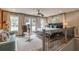 Open bedroom with a large bed, sitting area, and multiple windows with beautiful curtains at 1272 N Highland Ne Ave, Atlanta, GA 30306