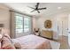 Bright bedroom featuring plush, quilted bed, modern ceiling fan, light walls, and hardwood floors at 1272 N Highland Ne Ave, Atlanta, GA 30306