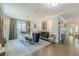 Spacious dining room featuring hardwood floors, decorative rug, stylish lighting, and elegant furniture at 1272 N Highland Ne Ave, Atlanta, GA 30306