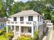 Beautiful two-story home with a lovely front porch, balcony, and well-manicured landscaping at 1272 N Highland Ne Ave, Atlanta, GA 30306