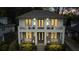 Elegant two-story home with a balcony, charming front porch, manicured landscaping, and stately curb appeal at 1272 N Highland Ne Ave, Atlanta, GA 30306