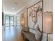 A spacious hallway featuring an oversized piece of art and views to the outside at 1272 N Highland Ne Ave, Atlanta, GA 30306