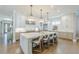 Bright kitchen features a large central island with seating, white cabinets, and hardwood floors at 1272 N Highland Ne Ave, Atlanta, GA 30306