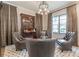 Inviting sitting room featuring stylish decor, plush seating, and elegant chandelier lighting at 1272 N Highland Ne Ave, Atlanta, GA 30306