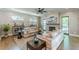 The living room with couches, tables, a fireplace and large windows with an open floor plan at 1272 N Highland Ne Ave, Atlanta, GA 30306