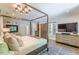 The main bedroom features a four-post bed, ensuite bath with sliding barn door, and flatscreen television at 1272 N Highland Ne Ave, Atlanta, GA 30306