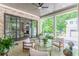 Charming covered patio with comfortable seating, and views of the backyard landscaping at 1272 N Highland Ne Ave, Atlanta, GA 30306