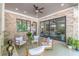 Stylish covered patio with brick accents and comfortable seating, perfect for outdoor relaxation at 1272 N Highland Ne Ave, Atlanta, GA 30306
