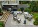 The backyard patio has an outdoor kitchen, a dining table with chairs, and a seating area with a sofa and chairs at 1272 N Highland Ne Ave, Atlanta, GA 30306