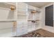 This large walk-in closet has custom shelving and hanging space, ensuring plenty of storage at 1272 N Highland Ne Ave, Atlanta, GA 30306