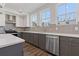 This kitchen has granite countertops, stainless steel appliances, and gray cabinets at 1779 Beckham Ne Pl # 58, Atlanta, GA 30324