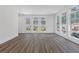This is a living room with floor to ceiling windows and hardwood floors at 1779 Beckham Ne Pl # 58, Atlanta, GA 30324