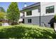 Well-maintained backyard showcasing green artificial turf, complemented by the home's architectural design at 2641 Drew Valley Ne Rd, Brookhaven, GA 30319