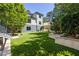 Spacious backyard featuring lush artificial turf and a modern retaining wall, perfect for outdoor entertaining at 2641 Drew Valley Ne Rd, Brookhaven, GA 30319