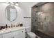 Modern bathroom featuring an oval mirror and a glass enclosed shower at 2641 Drew Valley Ne Rd, Brookhaven, GA 30319