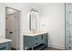 Stylish bathroom boasting a vanity with marble countertop, modern fixtures, and a glass-enclosed shower at 2641 Drew Valley Ne Rd, Brookhaven, GA 30319