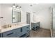 Bright bathroom features double vanity, modern fixtures, and tiled shower, offering a luxurious and functional space at 2641 Drew Valley Ne Rd, Brookhaven, GA 30319
