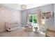 Floral Bedroom with a beaded chandelier, plush chair, and bright window at 2641 Drew Valley Ne Rd, Brookhaven, GA 30319