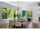 Bright dining room with backyard views with sliding door to outdoor seating area at 2641 Drew Valley Ne Rd, Brookhaven, GA 30319