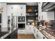 Modern kitchen features stainless steel appliances, custom cabinets, and geometric backsplash at 2641 Drew Valley Ne Rd, Brookhaven, GA 30319
