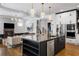 Bright, modern kitchen with a large island, barstool seating, and stainless steel appliances at 2641 Drew Valley Ne Rd, Brookhaven, GA 30319