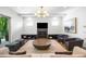 Stylish living room with fireplace, modern light fixture, and a comfortable seating area at 2641 Drew Valley Ne Rd, Brookhaven, GA 30319
