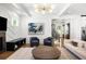 Spacious living room with stylish decor, including a fireplace and open access to the staircase at 2641 Drew Valley Ne Rd, Brookhaven, GA 30319