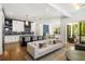 Modern living room open to the kitchen and featuring access to the outdoor patio at 2641 Drew Valley Ne Rd, Brookhaven, GA 30319