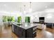Spacious open-concept kitchen, living and dining area with island and access to outdoor living at 2641 Drew Valley Ne Rd, Brookhaven, GA 30319
