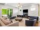 Open living room featuring a fireplace, large rug, and an open glass patio door at 2641 Drew Valley Ne Rd, Brookhaven, GA 30319