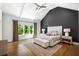 Serene main bedroom features a vaulted ceiling, hardwood floors, and a window with natural light at 2641 Drew Valley Ne Rd, Brookhaven, GA 30319