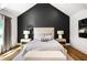 Calming main bedroom with large window, hardwood floors, and designer accent wall at 2641 Drew Valley Ne Rd, Brookhaven, GA 30319